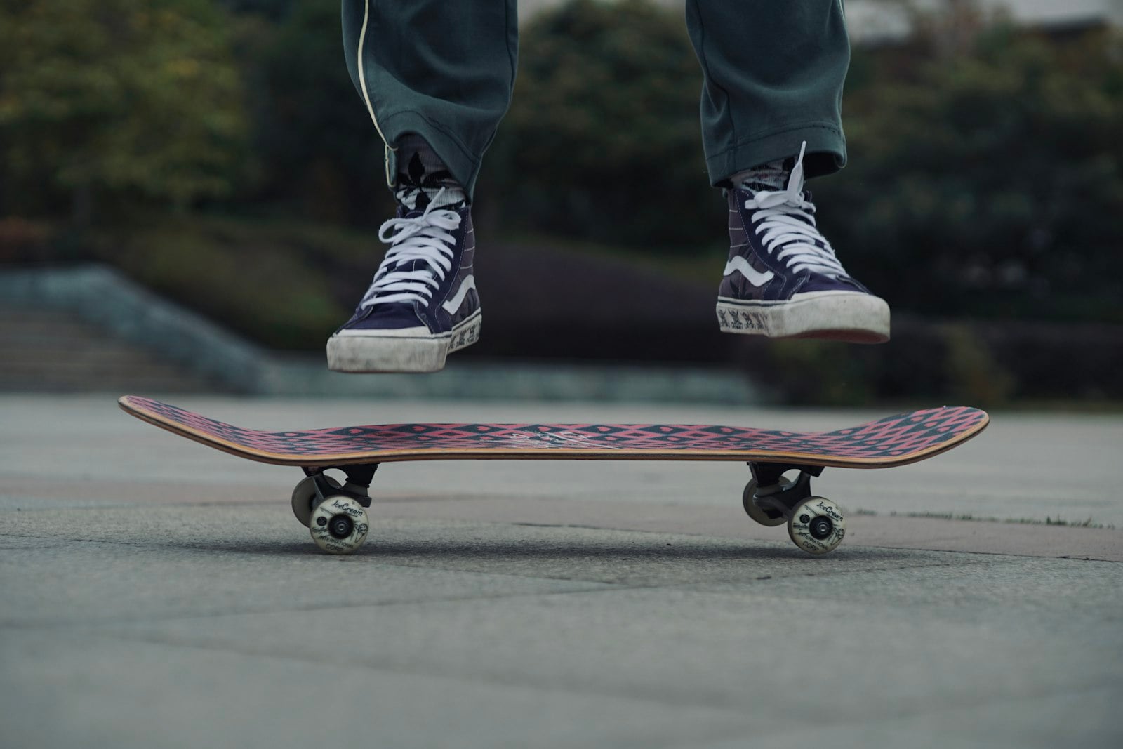 Skater in black high-top shoes riding a skateboard (photo: Meatball Overexposure / Unsplash)