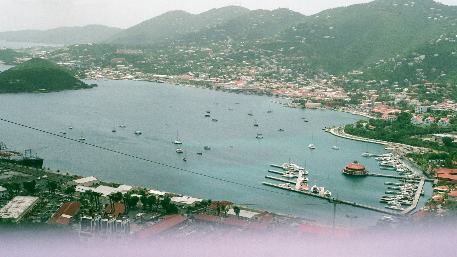 An island harbour and town seen from above (photo: Brendan Stephens / Unsplash)