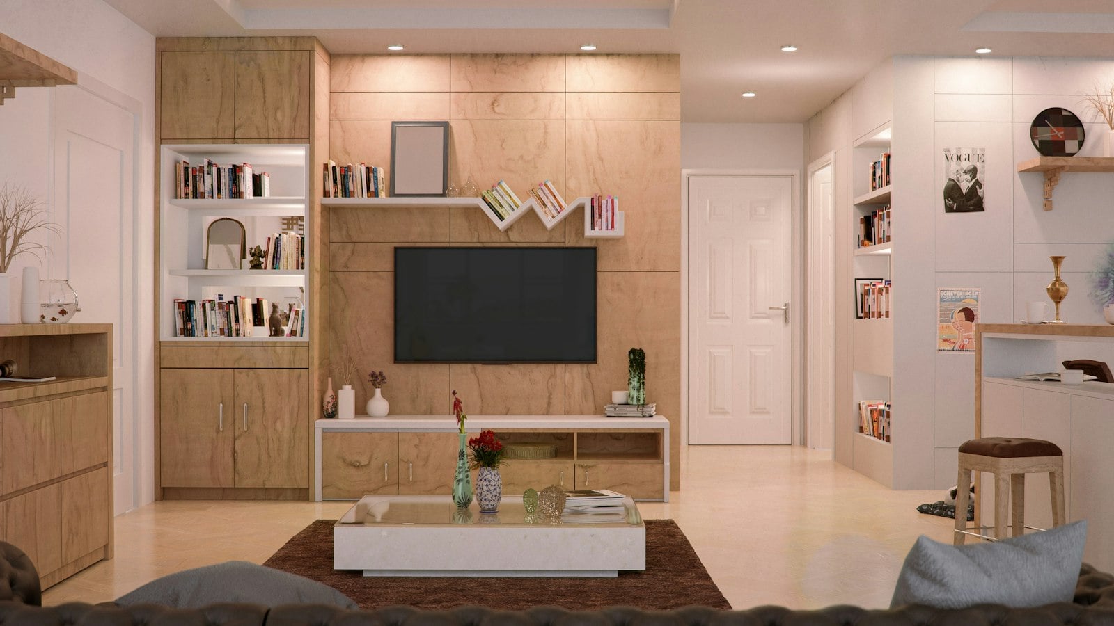 A bright living room with a wall-mounted TV and shelving (photo: nuddle / Unsplash)